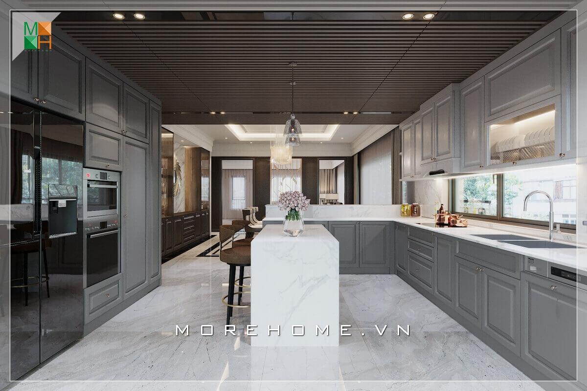 Mẫu thiết kế phòng bếp không gian mở, với hệ thống tủ bếp gỗ kết hợp mặt bàn đá nhân tạo cao cấp với màu trắng - xám, là màu sắc của sự cân bằng, trung tính, mang đến vẻ đẹp sang trọng tinh tế cho không gian phòng bếp
